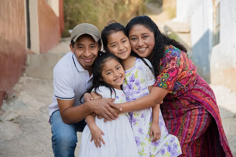 hispanic and latinx family hugging
