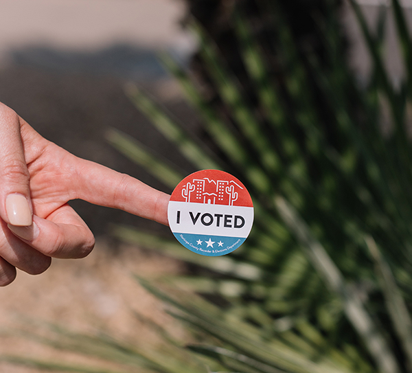 i voted sticker on finger
